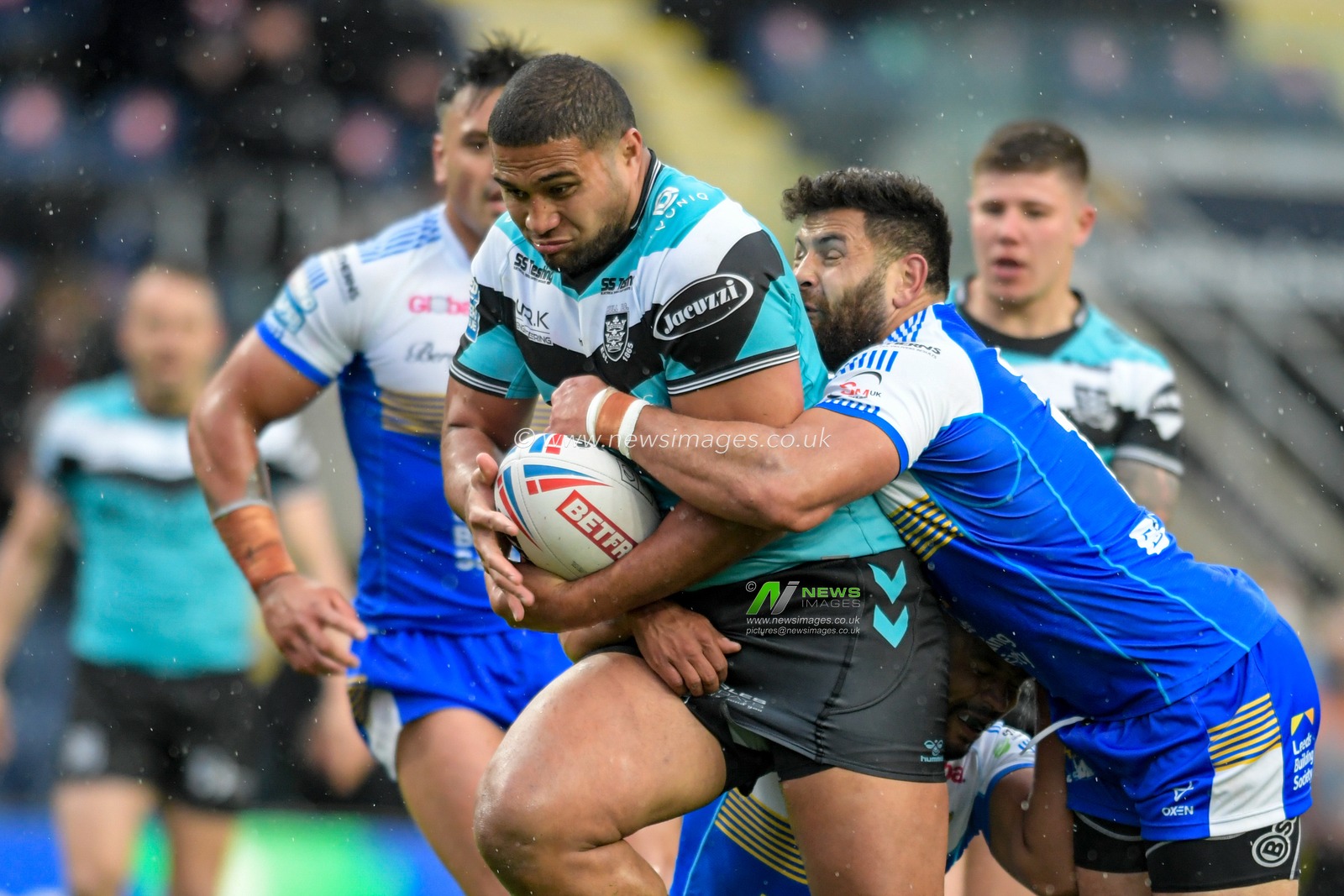 Chris Satae (10) of Hull FC drives the ball forward