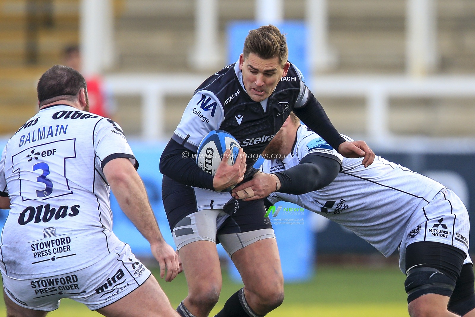 Toby Flood of Newcastle Falcons tries to break the Gloucester Rugby defensive line