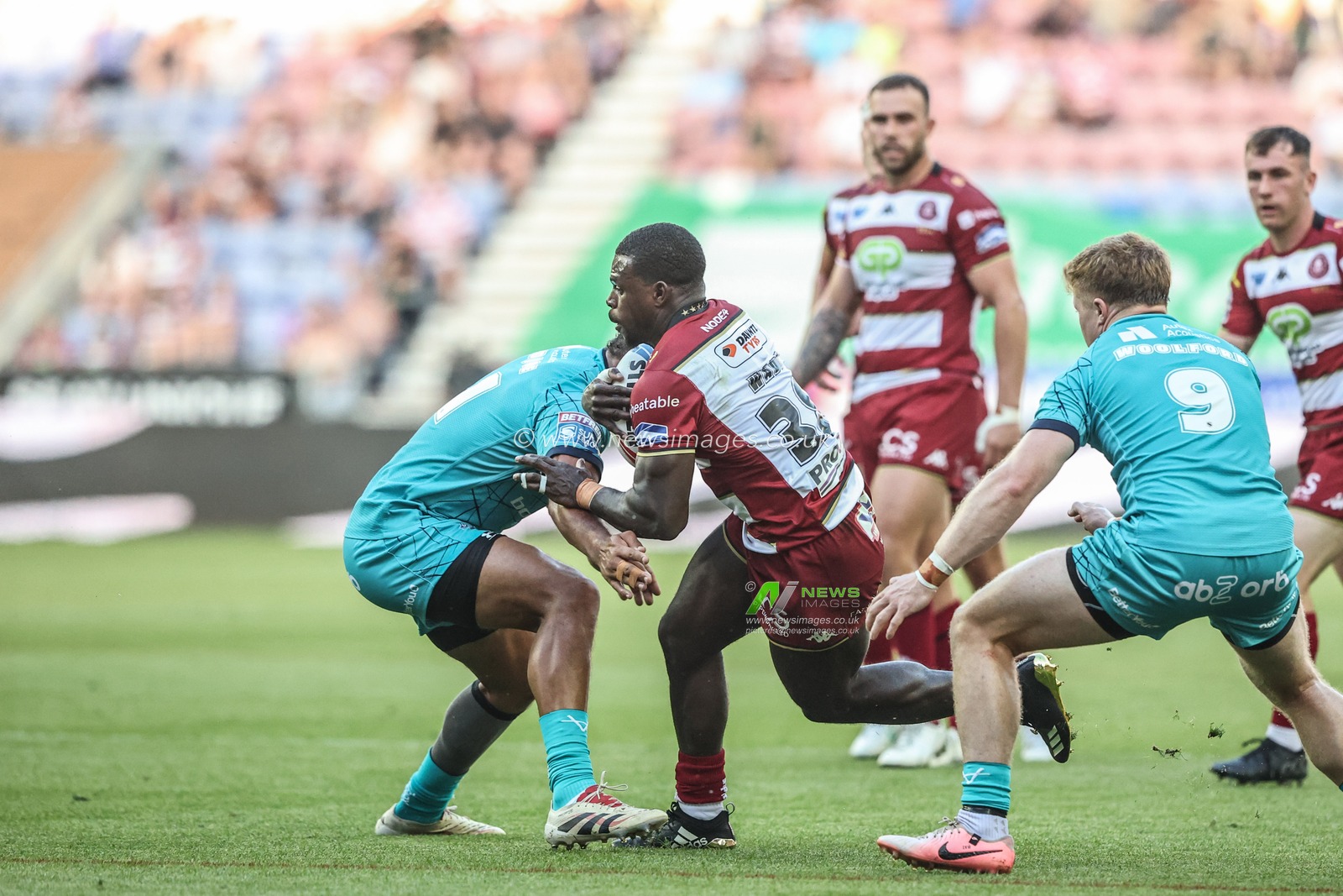 Christian Wade of Wigan Warriors is tackled during the Betfred Super League round 18 match Wigan Warriors vs Huddersfield Giants at The Brick Community Stadium, Wigan, United Kingdom, 11th July 2025

(Photo by Alfie Cosgrove/News Images)
