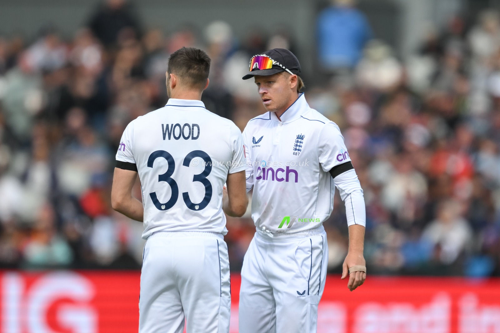 Ollie Pope of England speaks with Mark Wood of England before he begins to bowl during the England Men v Sri Lanka 1st Rothesay Test Match Day 3 at Old Trafford, Manchester, United Kingdom, 23rd August 2024

(Photo by Craig Thomas/News Images)