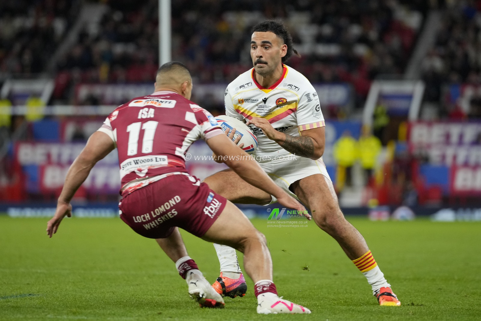 Tyrone May #6 of Catalans Dragons runs at Willie Isa #11 of Wigan Warriors during the Betfred Super League Grand Final match Wigan Warriors vs Catalans Dragons at Old Trafford, Manchester, United Kingdom, 14th October 2023

(Photo by Steve Flynn/News Images)