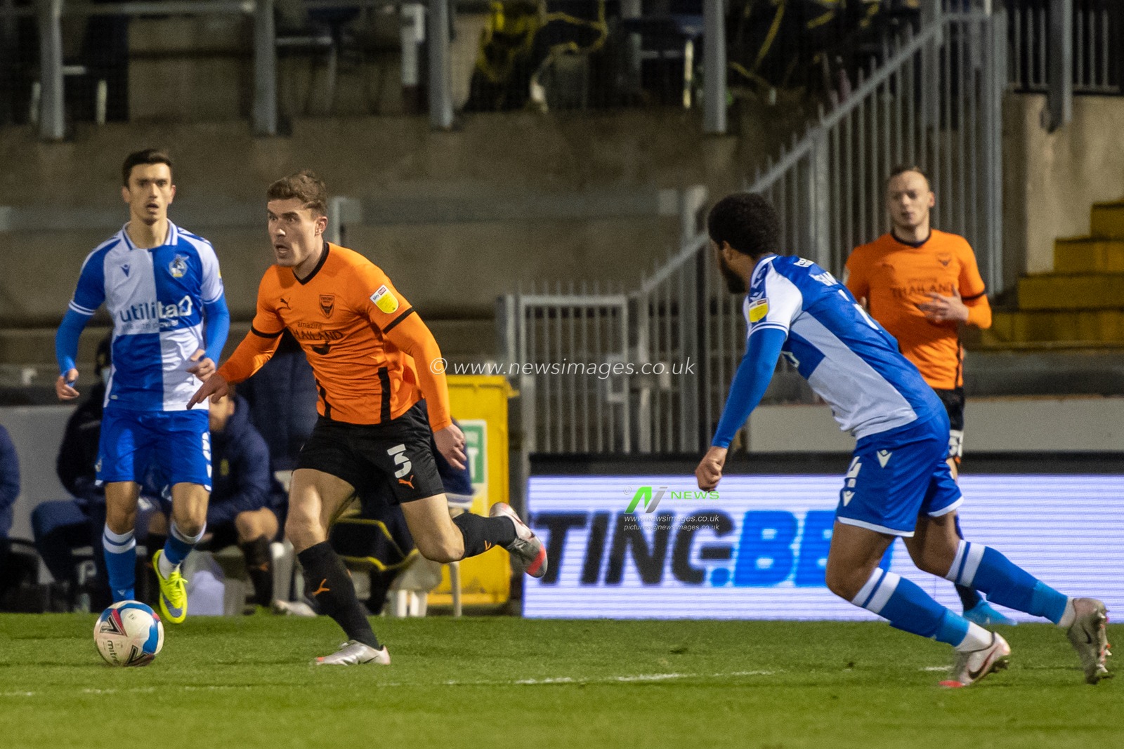 Josh Ruffels #3 of Oxford United looks for the best pass