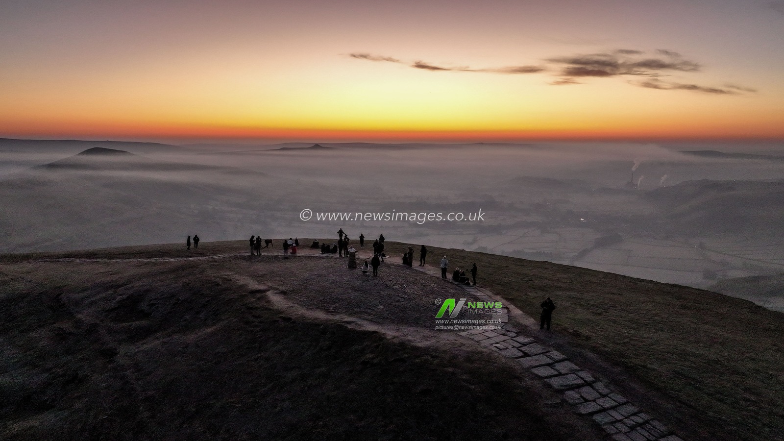People head to the summit of Mam Tor to watch the sun rise as a blanket of fog lingers over the Hope Valley at Mam Tor, Peak District, United Kingdom, 19th March 2025

(Photo by Mark Cosgrove/News Images)
