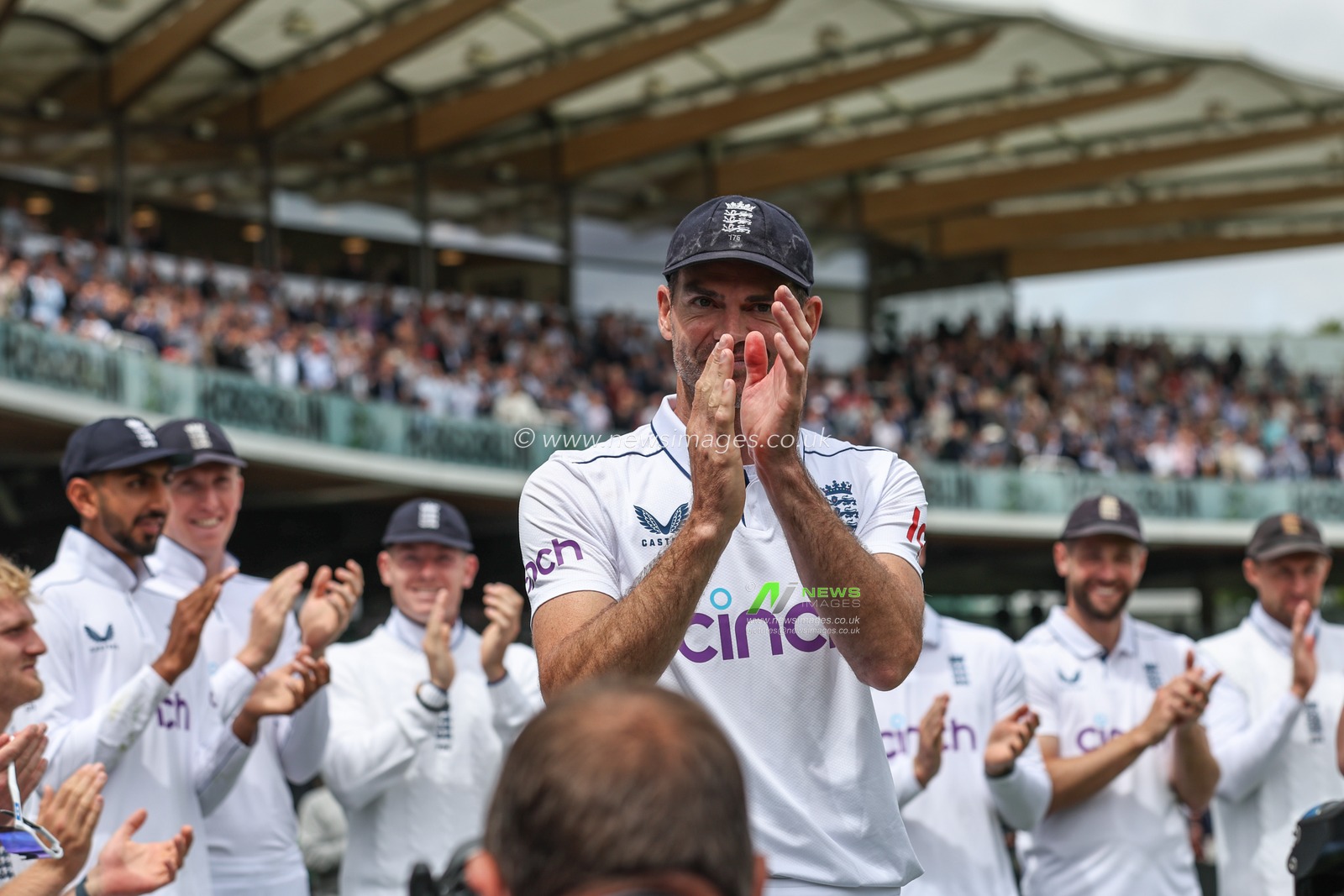 James Anderson of England is applauded by his teammates after his last game for England during the Rothesay First Test Match Day Three England v West Indies at Lords, London, United Kingdom, 12th July 2024

(Photo by Mark Cosgrove/News Images)