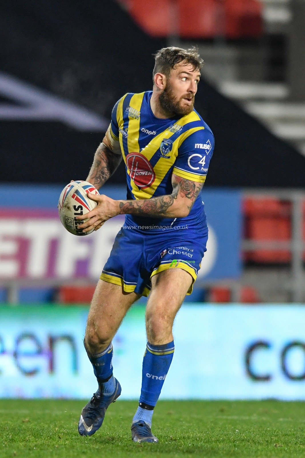 Daryl Clark (9) of Warrington Wolves looks for a pass