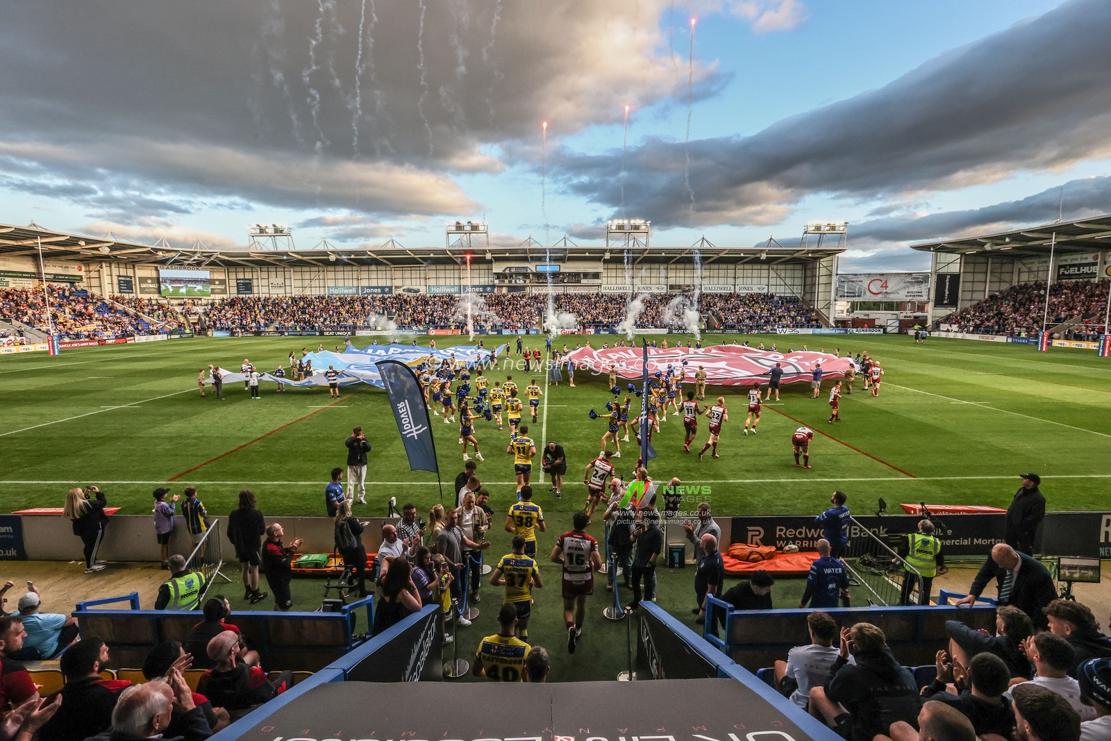 The teams come out for the game during the Betfred Super League round 21 match Warrington Wolves vs Wigan Warriors at Halliwell Jones Stadium, Warrington, United Kingdom, 8th August 2025

(Photo by Alfie Cosgrove/News Images)