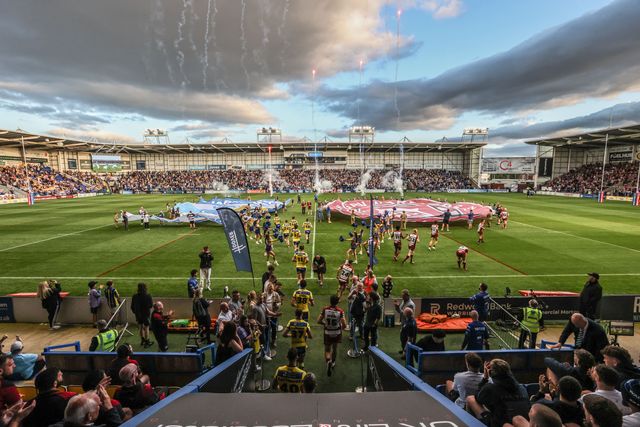 The teams come out for the game during the Betfred Super League round 21 match Warrington Wolves vs Wigan Warriors at Halliwell Jones Stadium, Warrington, United Kingdom, 8th August 2025

(Photo by Alfie Cosgrove/News Images)