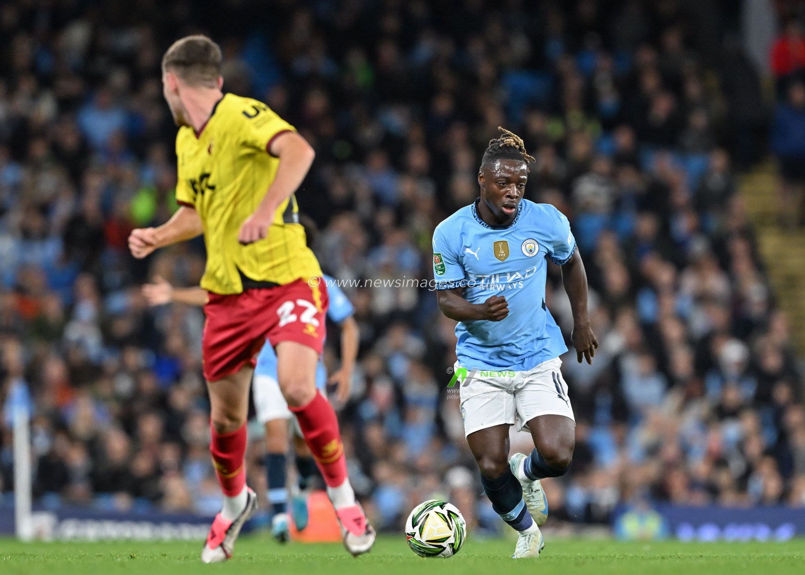 JÃ©rÃ©my Doku of Manchester City breaks forwards with the ball during the Carabao Cup match Manchester City vs Watford at Etihad Stadium, Manchester, United Kingdom, 24th September 2024

(Photo by Cody Froggatt/News Images)