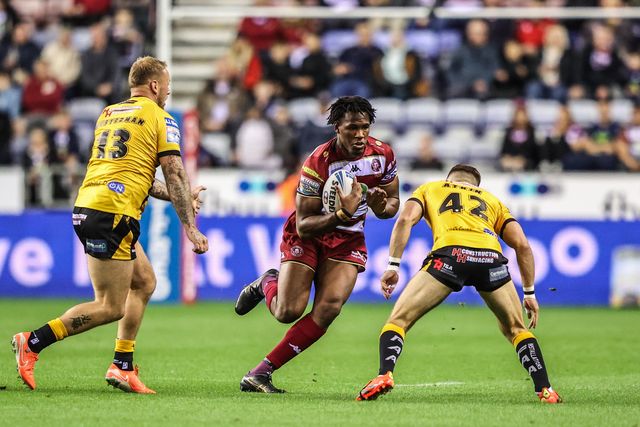Junior Nsemba of Wigan Warriors is tackled by Jacob Atkin of Castleford Tigers during the Betfred Super League Round 26 match Wigan Warriors vs Castleford Tigers at The Brick Community Stadium, Wigan, United Kingdom, 12th September 2025

(Photo by Alfie Cosgrove/News Images)