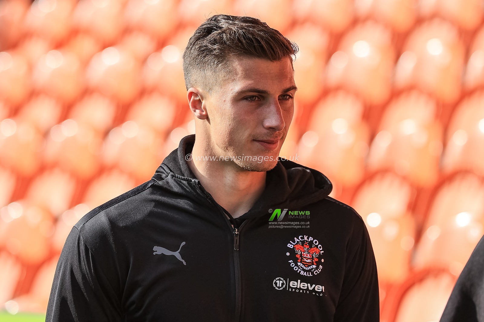 Stuart Moore #13 of Blackpool arrives at Bloomfield Road
