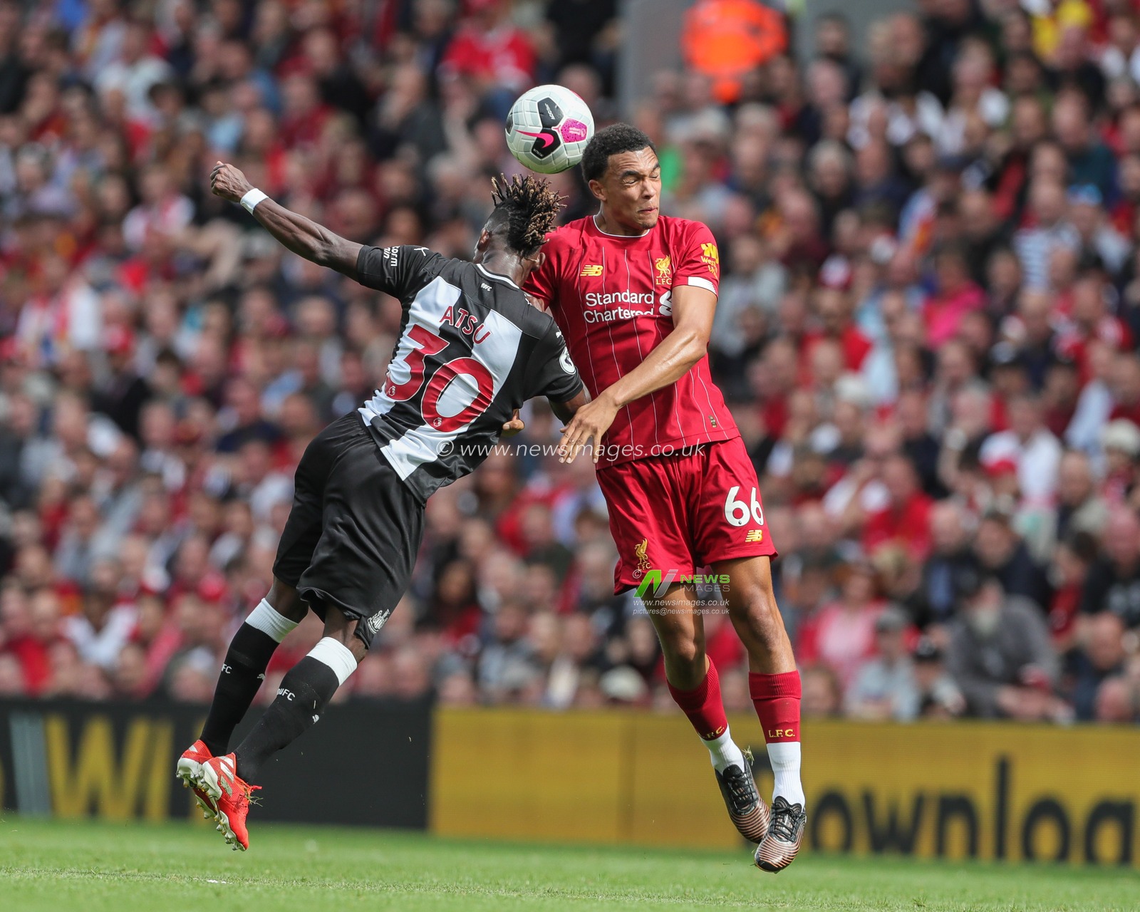 14th September 2019 , Anfield, Liverpool, England; Premier League Football, Liverpool vs Newcastle United ; Trent Alexander-Arnold (66) of Liverpool  and Christian Atsu (30) of Newcastle United dual for the ball 


Credit: Mark Cosgrove/News Images 


Premier League/EFL Football images are subject to DataCo Licence
