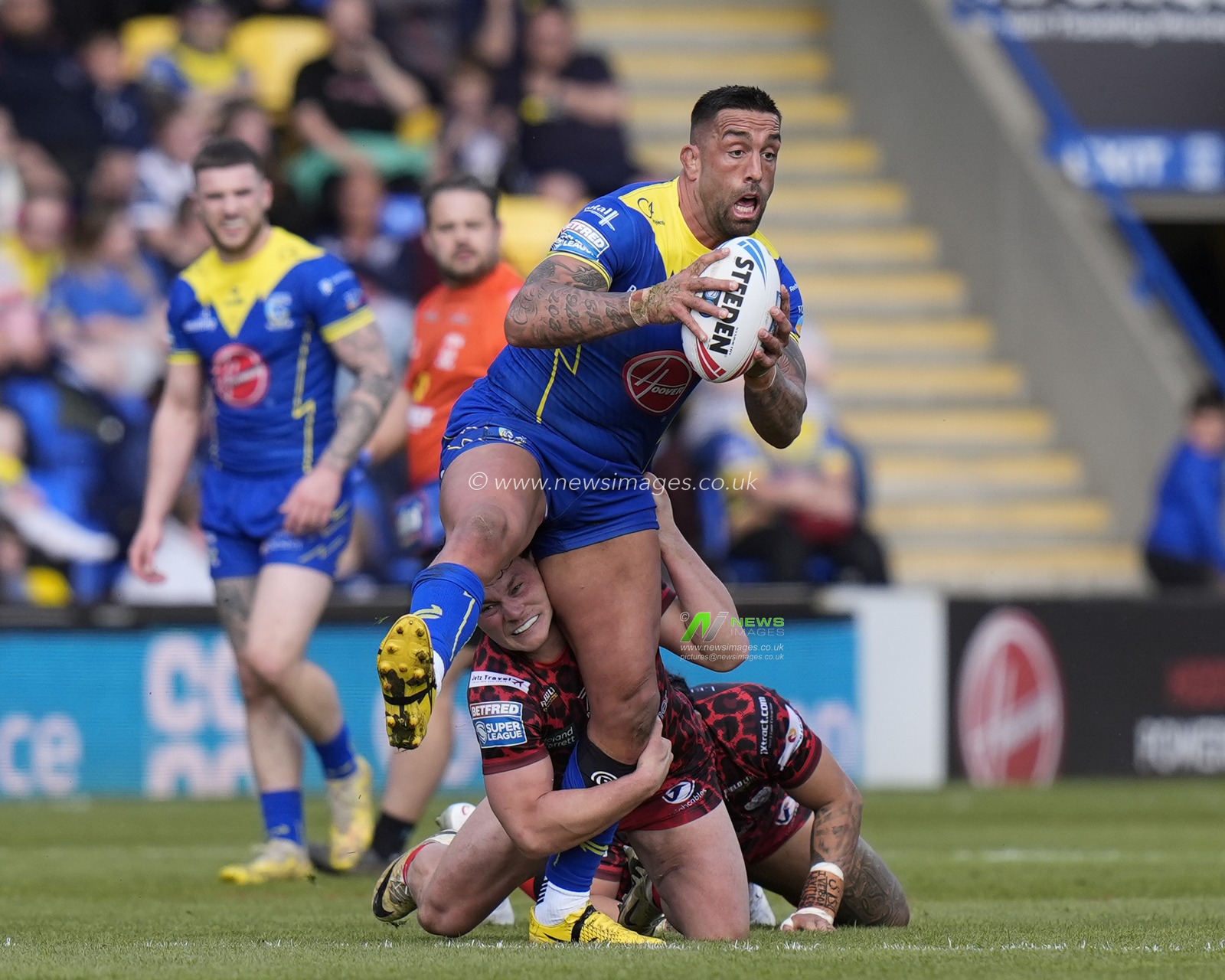 Paul Vaughan of Warrington Wolves is held by Lachlan Lam of Leigh Leopards during the Betfred Super League Round 8 match Warrington Wolves vs Leigh Leopards at Halliwell Jones Stadium, Warrington, United Kingdom, 20th April 2024

(Photo by Steve Flynn/News Images)