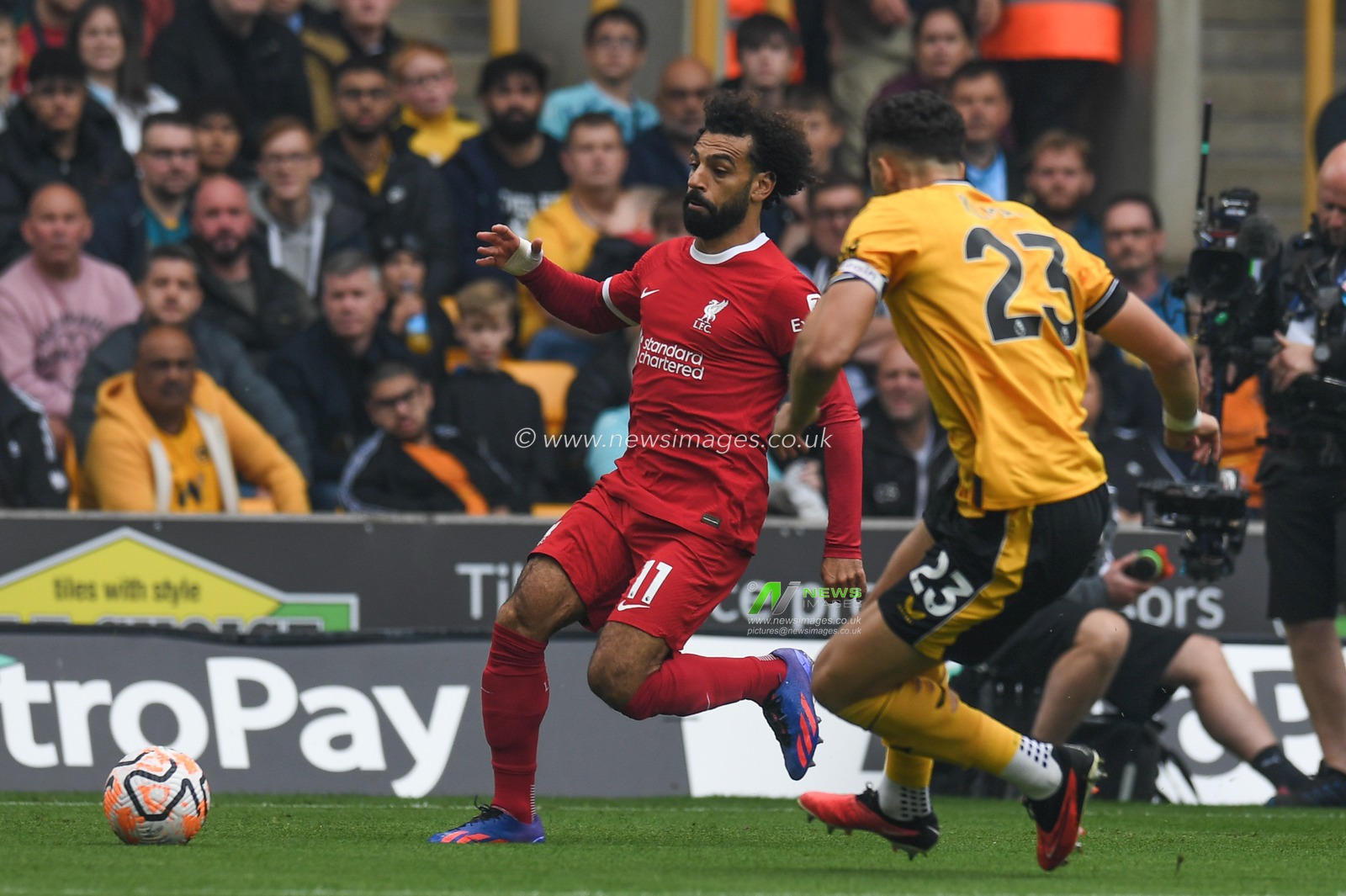Mohamed Salah #11 of Liverpool takes on Max Kilman #23 of Wolverhampton Wanderers during the Premier League match Wolverhampton Wanderers vs Liverpool at Molineux, Wolverhampton, United Kingdom, 16th September 2023

(Photo by Mike Jones/News Images)
