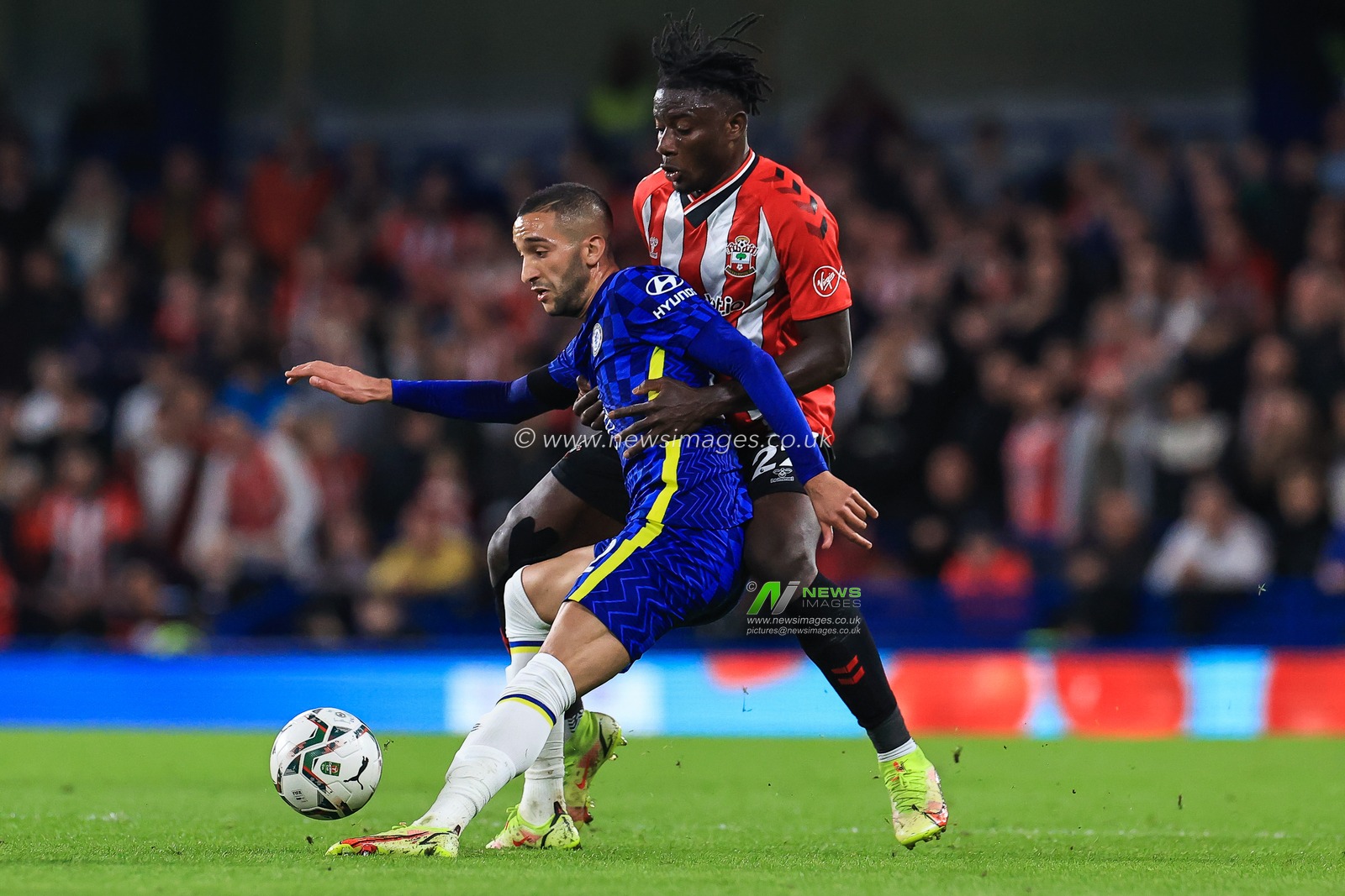 Hakim Ziyech #22 of Chelsea holds of Mohammed Salisu #22 of Southampton