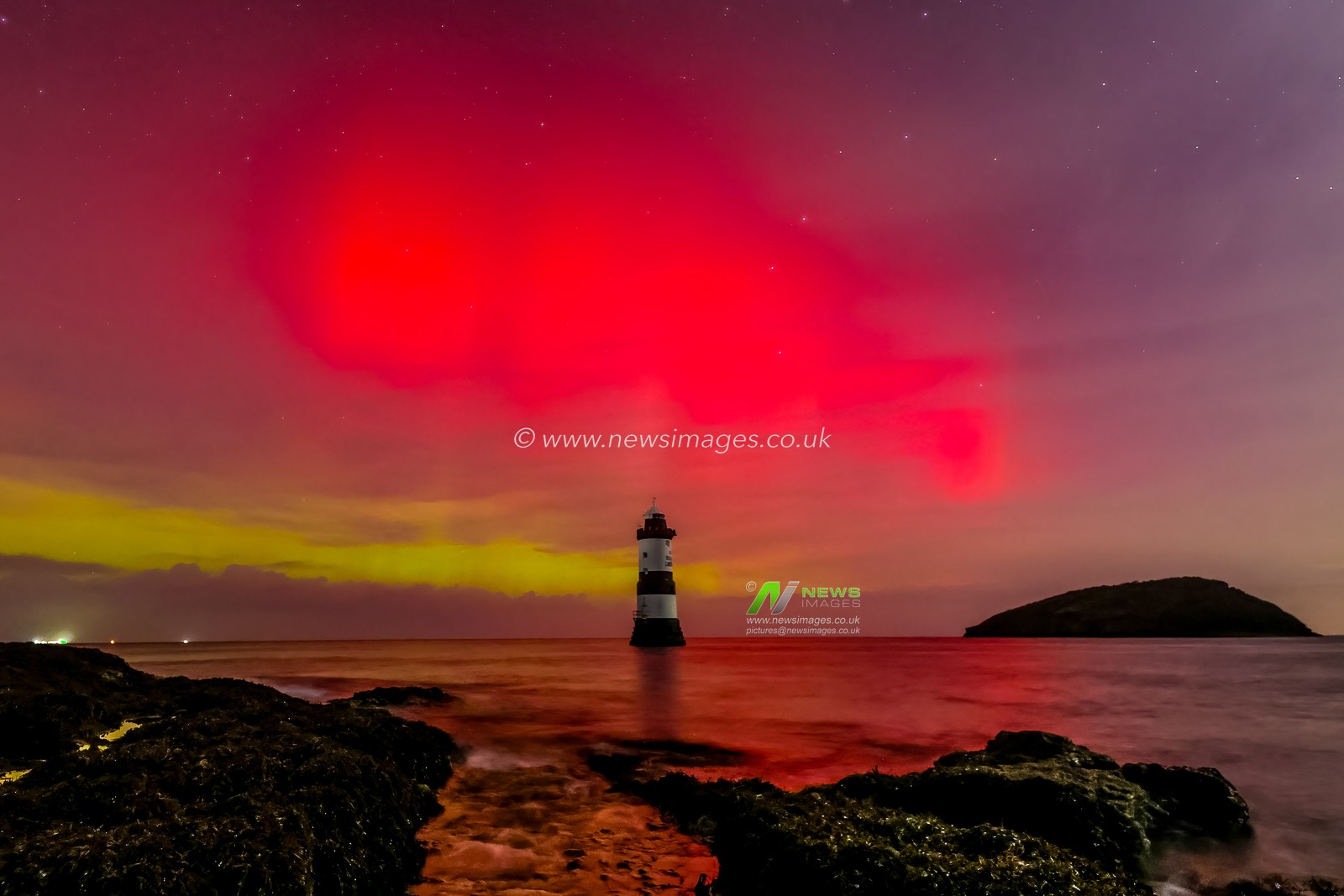 Northern Lights also know as the Aurora Borealis shine and dance over Penmon Lighthouse, Penmon, on Anglesey, United Kingdom, 12th November 2025

(Photo by Mark Cosgrove/News Images)

*** GER AUT SUI OUT ***