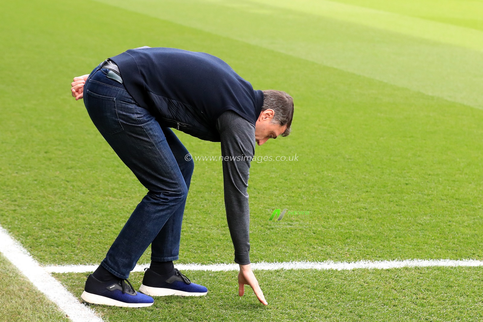 Shota Arveladze manager of Hull City checks the turf prior to kick off.
