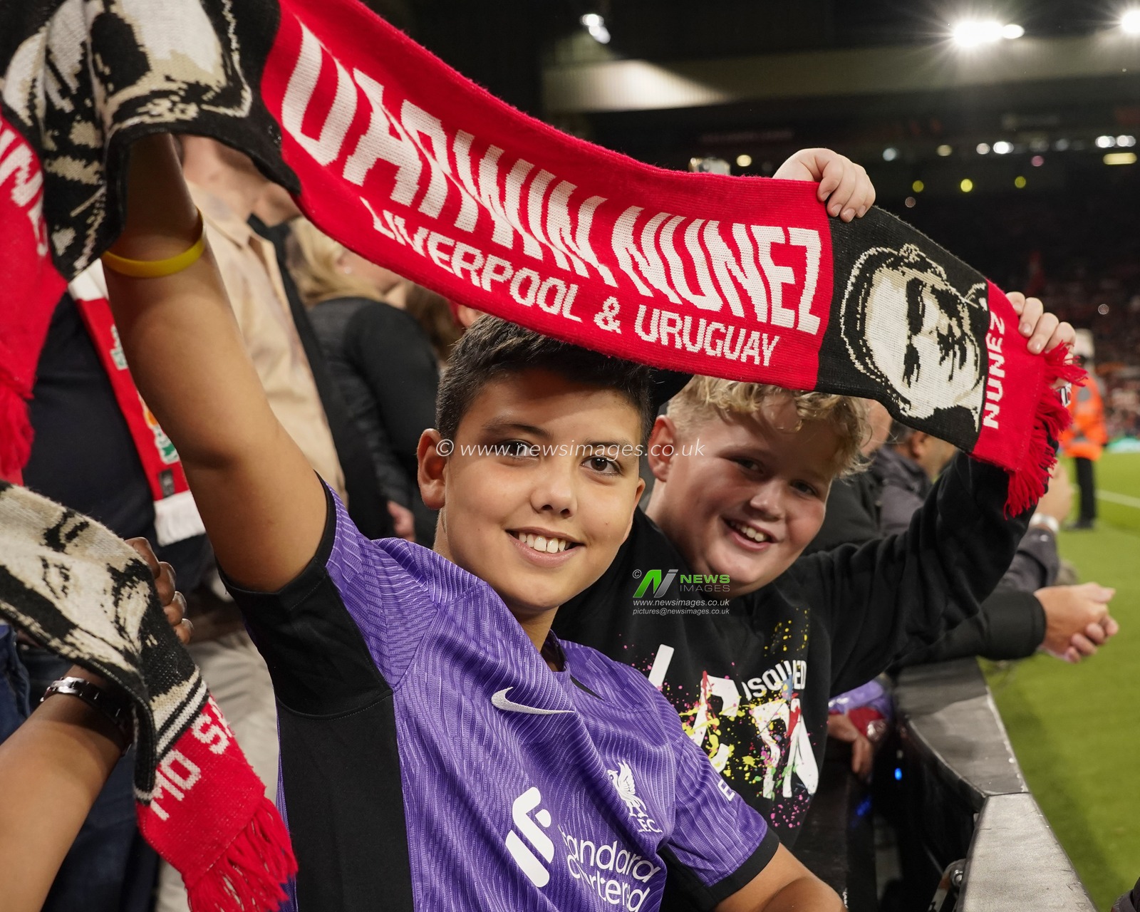 Young Liverpool fans hold a Darwin Nunez scarf before the UEFA Europa League match Liverpool vs Union Saint-Gilloise at Anfield, Liverpool, United Kingdom, 5th October 2023

(Photo by Steve Flynn/News Images)