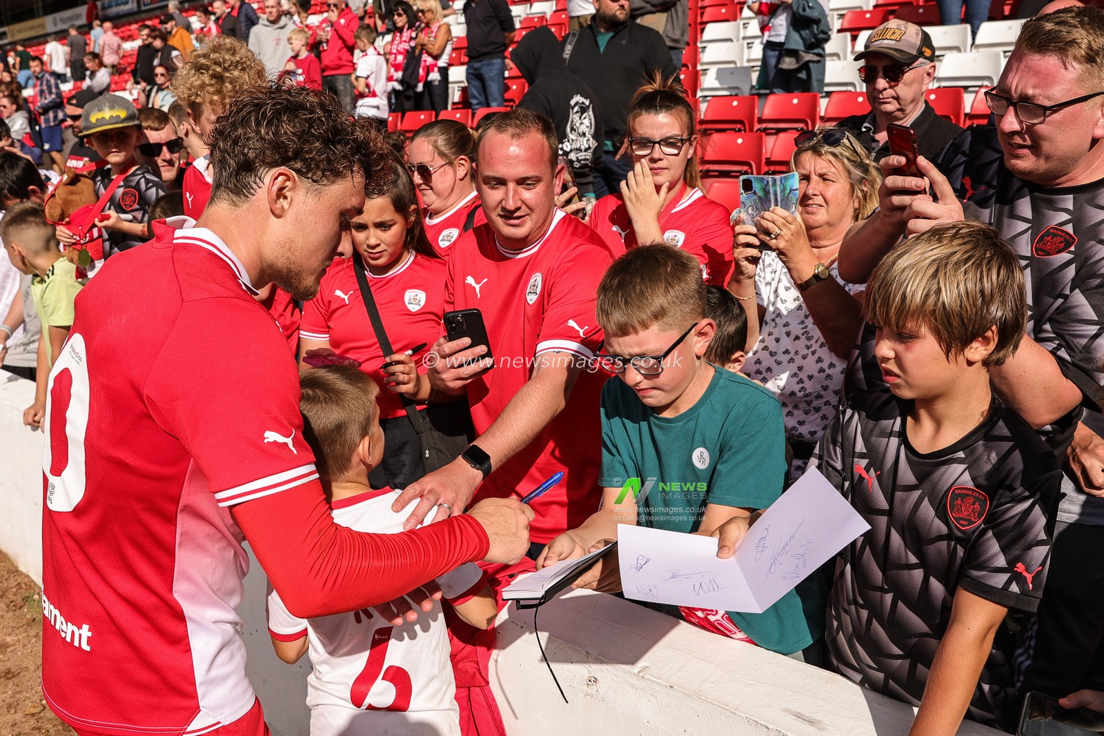 Callum Styles #10 of Barnsley signs autographduring the Pre-season friendly match Barnsley vs Crewe Alexandra at Oakwell, Barnsley, United Kingdom, 29th July 2023

(Photo by Mark Cosgrove/News Images)