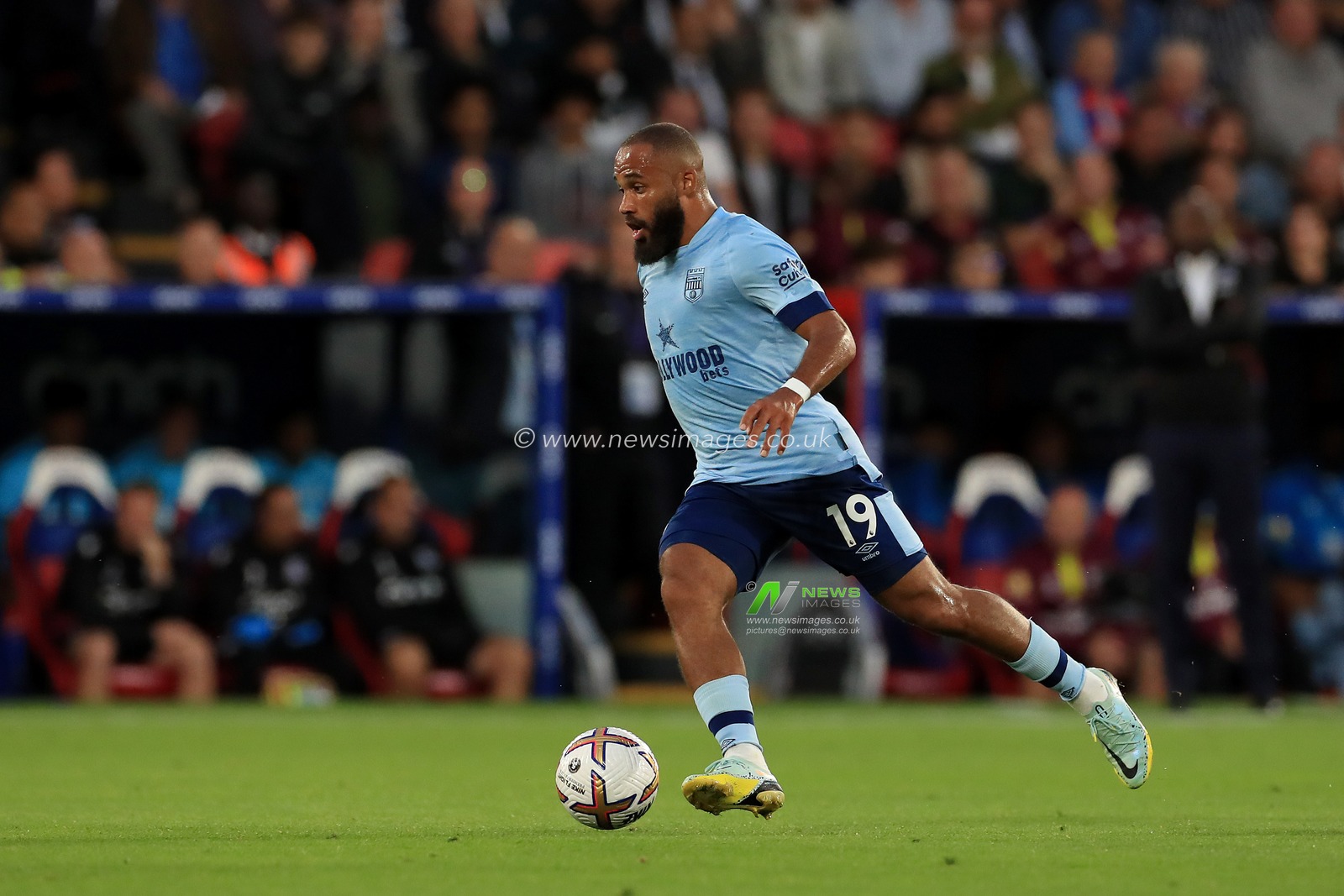 Bryan Mbeumo #19 of Brentford dribbling with the ball.