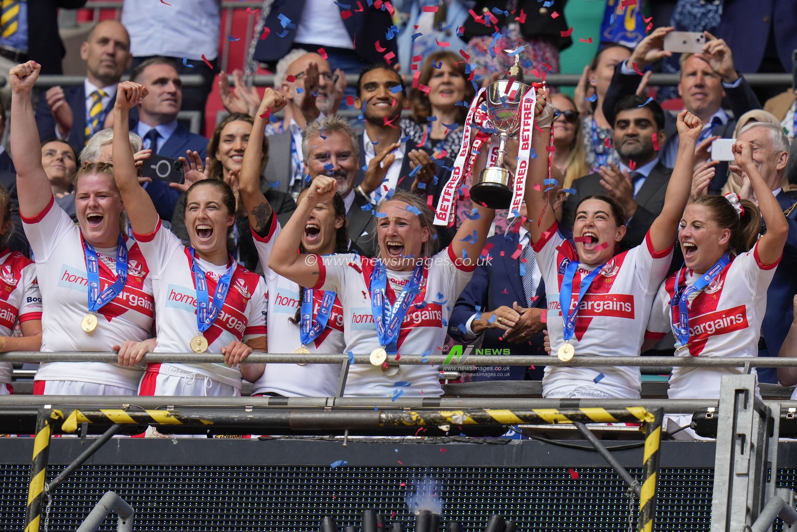 Jodie Cunningham #13 of St. Helens and Emily Rudge #12 of St. Helens lift the BetFred Women's Challenge Cup trophy after the Betfred Challenge Cup match Hull KR vs Leigh Leopards at Wembley Stadium, London, United Kingdom, 12th August 2023

(Photo by Steve Flynn/News Images)