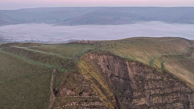 Sunrise hikers walk to the summit of Mam Tor as they watch the sunrise and admire the cloud inversion in the Hope Valley at Mam Tor in the Peak District at Mam Tor, Castleton, United Kingdom on 21 March 2026

(Photo by Mark Cosgrove/News Images)
