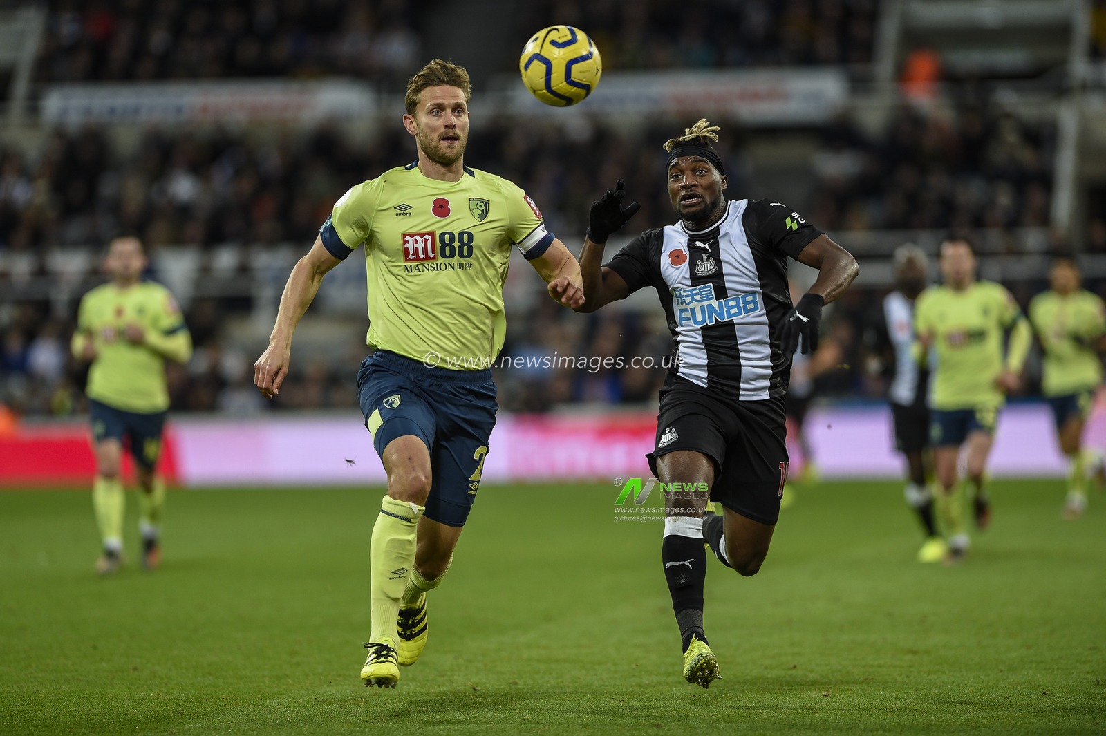 9th November 2019, St. James's Park, Newcastle, England; Premier League, Newcastle United v Bournemouth : Allan Saint-Maximin (10) of Newcastle United tries to beat Simon Francis (2) of Bournemouth to the ball

Credit: Iam Burn/News Images