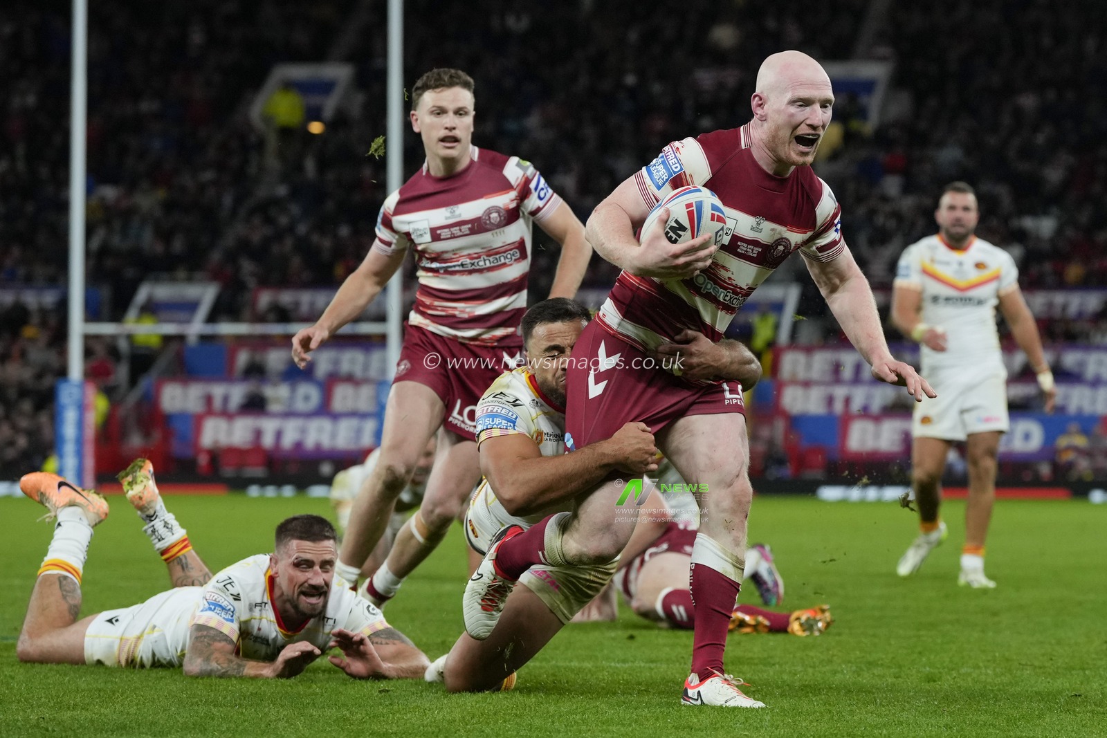 Liam Farrell #12 of Wigan Warriors makes a break during the Betfred Super League Grand Final match Wigan Warriors vs Catalans Dragons at Old Trafford, Manchester, United Kingdom, 14th October 2023

(Photo by Steve Flynn/News Images)