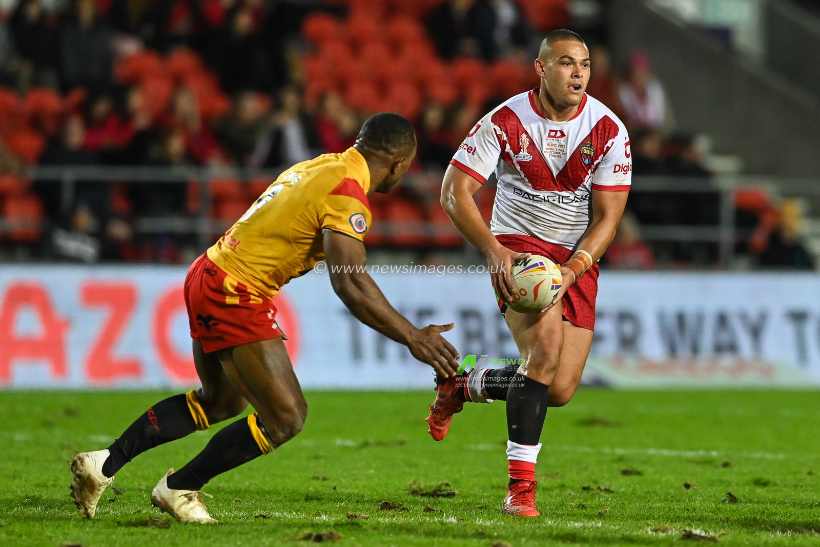 Tui Lolohea of Tonga makes a break during the Rugby League World Cup 2021 match Tonga vs Papua New Guinea at Totally Wicked Stadium, St Helens, United Kingdom, 18th October 2022

(Photo by Craig Thomas/News Images)