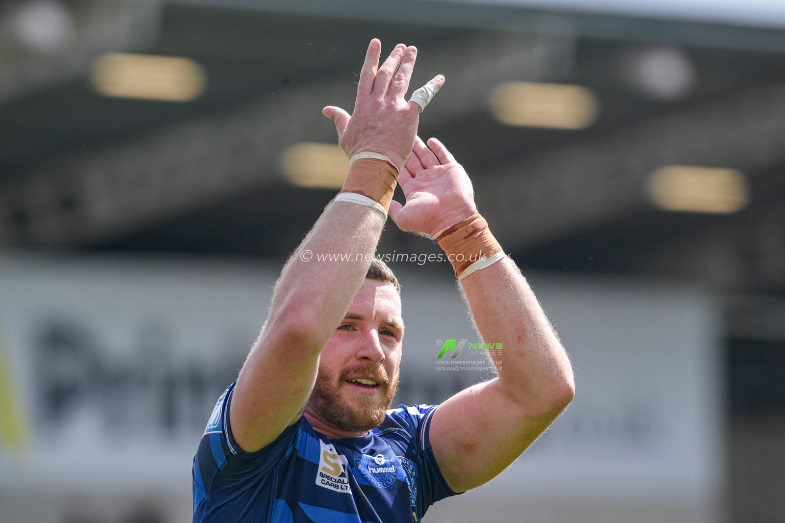 Jackson Hastings (31) of Wigan Warriors applauds the travelling supporters at the end of the game after his team beat Salford Red Devils 16-17