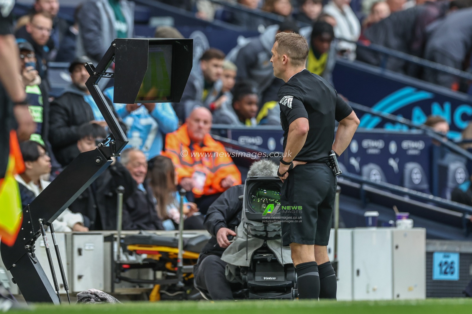 Referee Craig Pawson checks VAR for a second penalty during the Premier League match Manchester City vs Wolverhampton Wanderers at Etihad Stadium, Manchester, United Kingdom, 4th May 2024

(Photo by Mark Cosgrove/News Images)