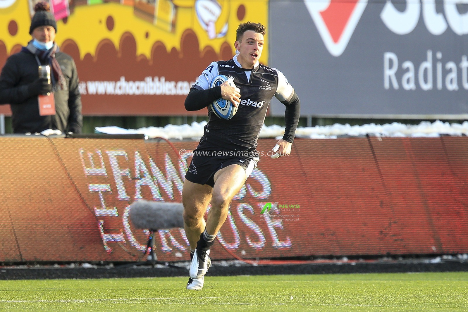 Adam Radwan of Newcastle Falcons carries the ball forward