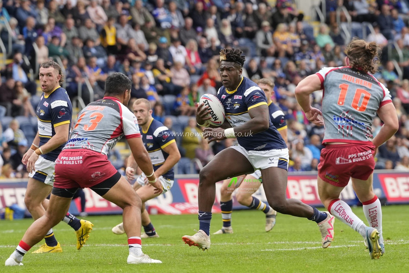 Justin Sangare #17 of Leeds Rhinos runs at John Asiata #13 of Leigh Leopards during the Betfred Super League Round 21 match Leeds Rhinos vs Leigh Leopards at Headingley Stadium, Leeds, United Kingdom, 6th August 2023

(Photo by Steve Flynn/News Images)