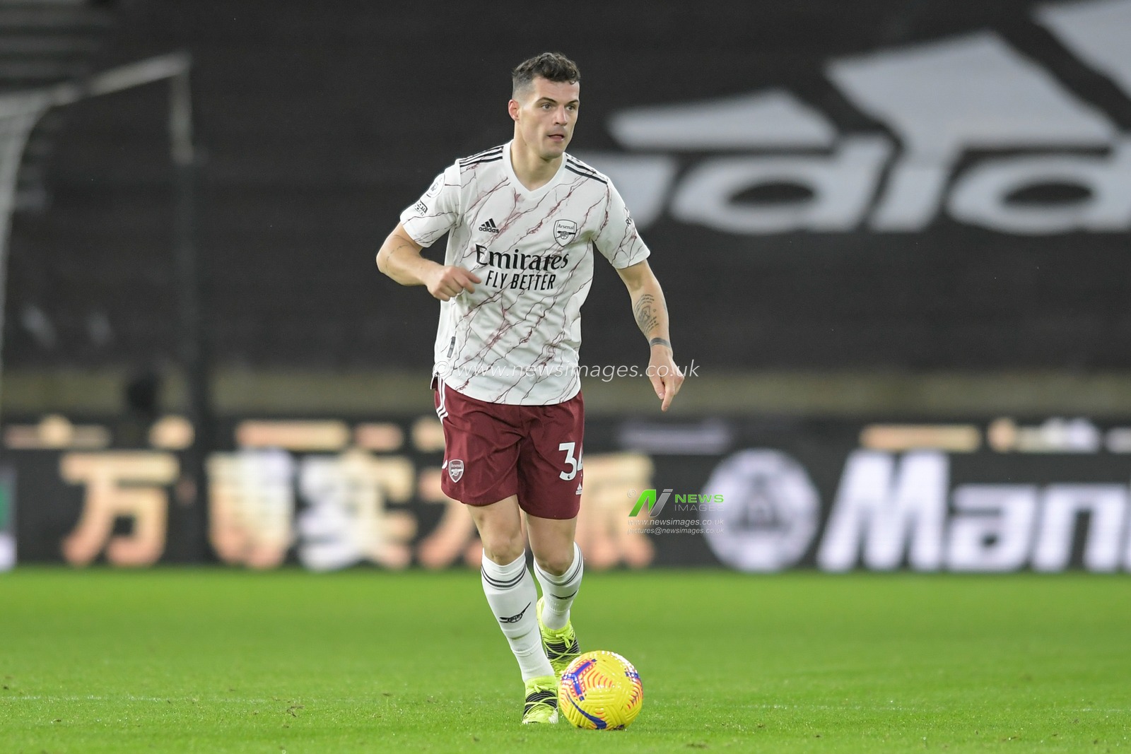 Granit Xhaka #34 of Arsenal runs forward with the ball