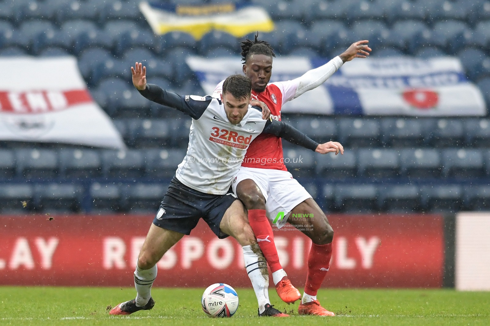 Freddie Ladapo #10 of Rotherham United challenges Ben Whiteman #17 of Preston North End for the ball