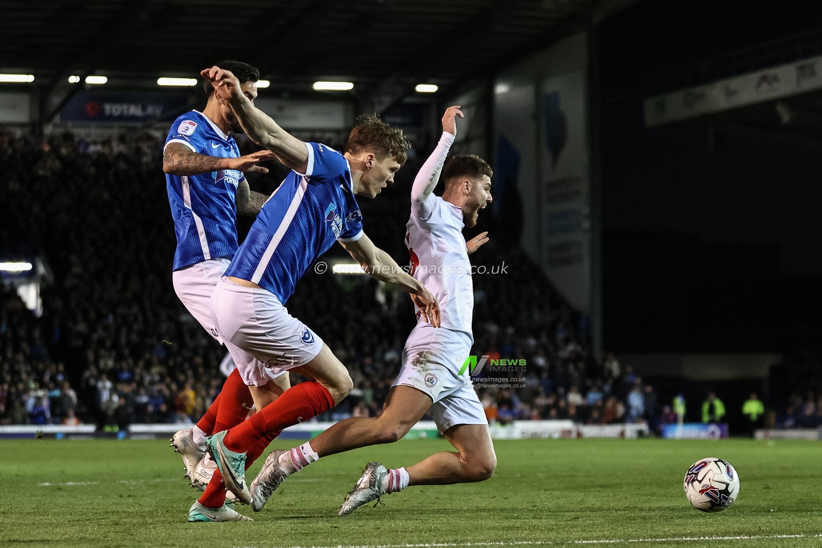 Marlon Pack #7 of Portsmouth catches John Mcatee of Barnsley in the area, no foul given during the Sky Bet League 1 match Portsmouth vs Barnsley at Fratton Park, Portsmouth, United Kingdom, 16th April 2024

(Photo by Mark Cosgrove/News Images)