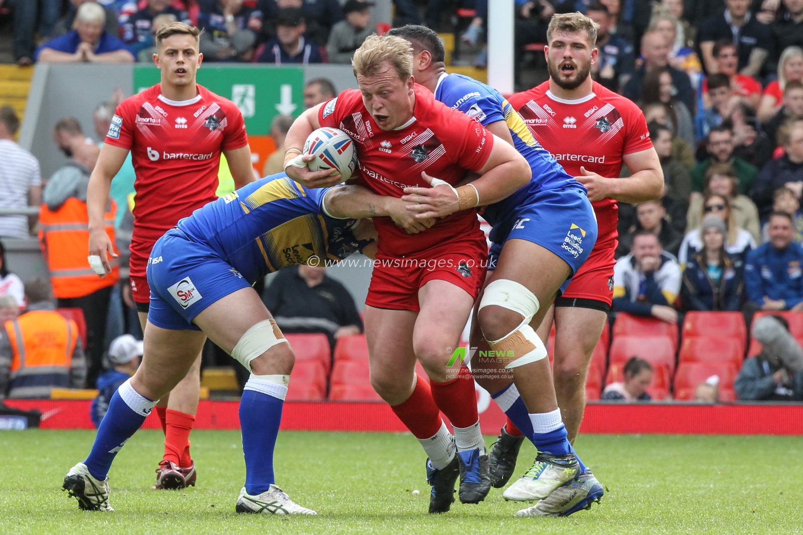 26th May 2019 , Anfield Stadium, Liverpool, England; Dacia Magic Weekend, Betfred Super League Round 16, Leeds Rhinos vs London Broncos ; Eddie Battye (8) of London Broncos is tackled by the Leeds defence

Credit: David Greaves/News Images