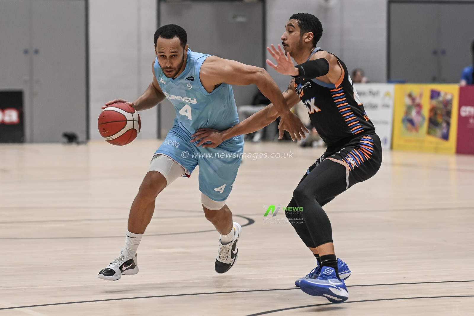 Andrew Lawrence of Surrey Scorchers drives past EJ Stephens of Cheshire Phoenix during the British Basketball Championship match Cheshire Phoenix vs Surrey Scorchers at Ellesmere Port Sports Village, Ellesmere Port, United Kingdom, 19th November 2023

(Photo by Craig Thomas/News Images)