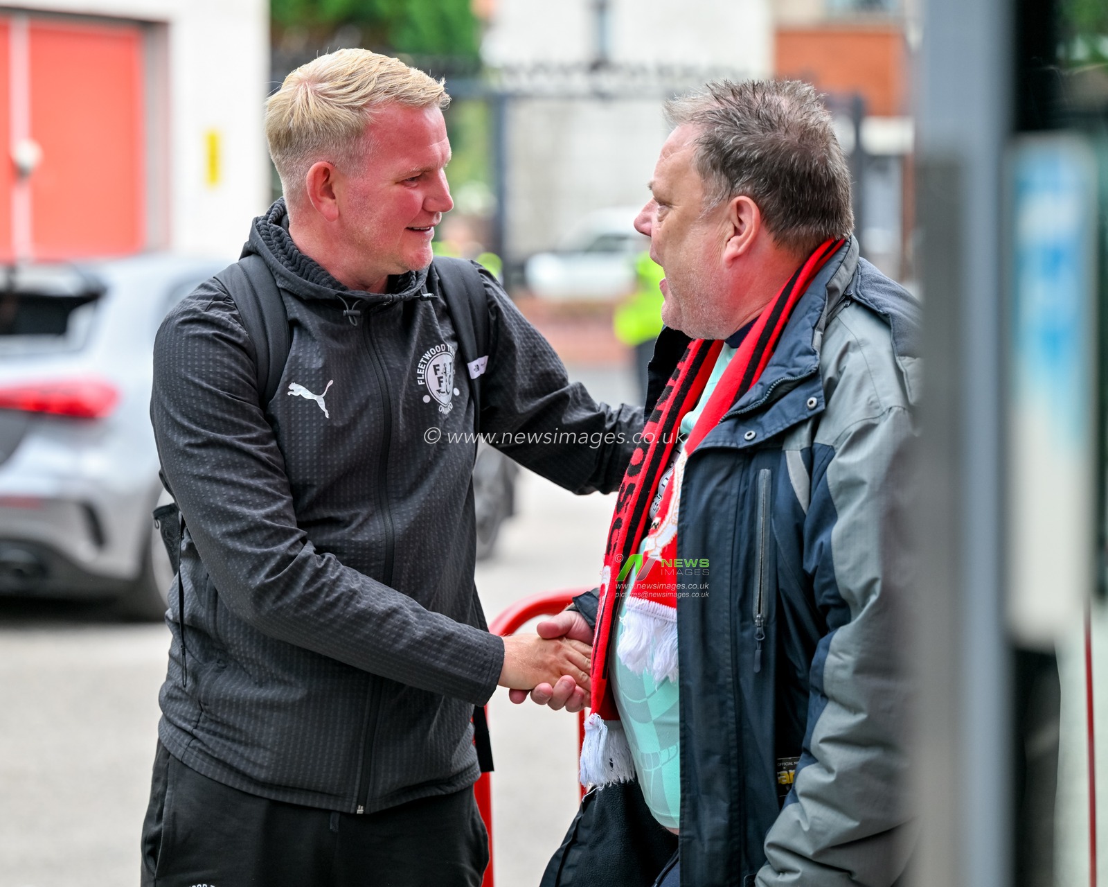 Pete Wild, head coach for Fleetwood Town meets a Fleetwood Town supporter during the Sky Bet League 2 match Fleetwood Town vs Oldham Athletic at Highbury Stadium, Fleetwood, United Kingdom, 23rd August 2025

(Photo by Adam Gee/News Images)