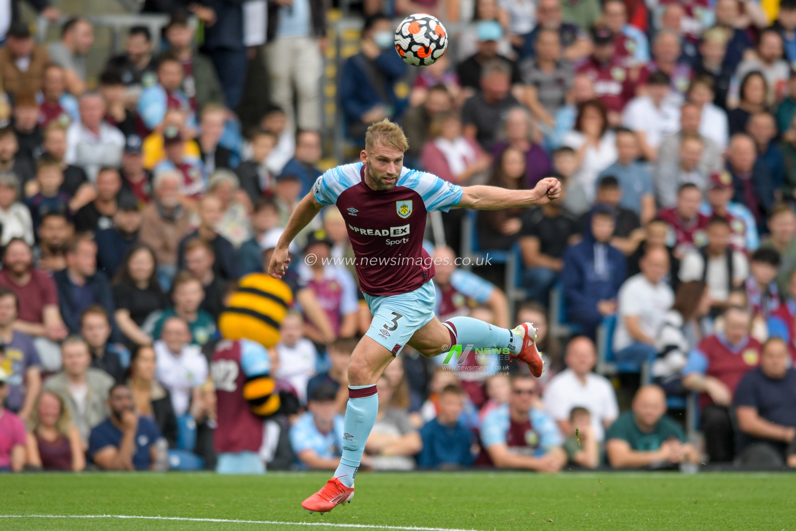 Charlie Taylor #3 of Burnley heads the ball