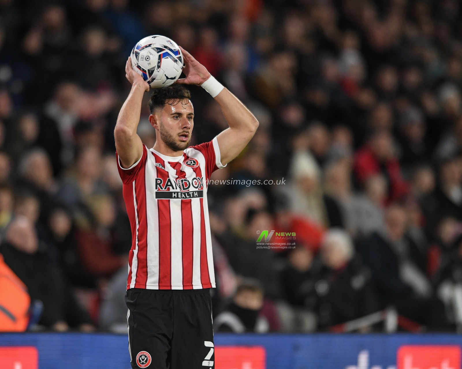 George Baldock #2 of Sheffield United takes a throw in