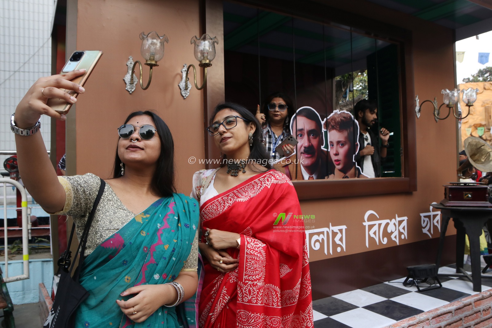 Film lovers take a selfie in front of an installation at a venue of the 30th Kolkata International Film Festival in Kolkata, India, on December 7, 2024.Â Pictures by Debajyoti Chakraborty.(Photo: Debajyoti Chakraborty/News Images)