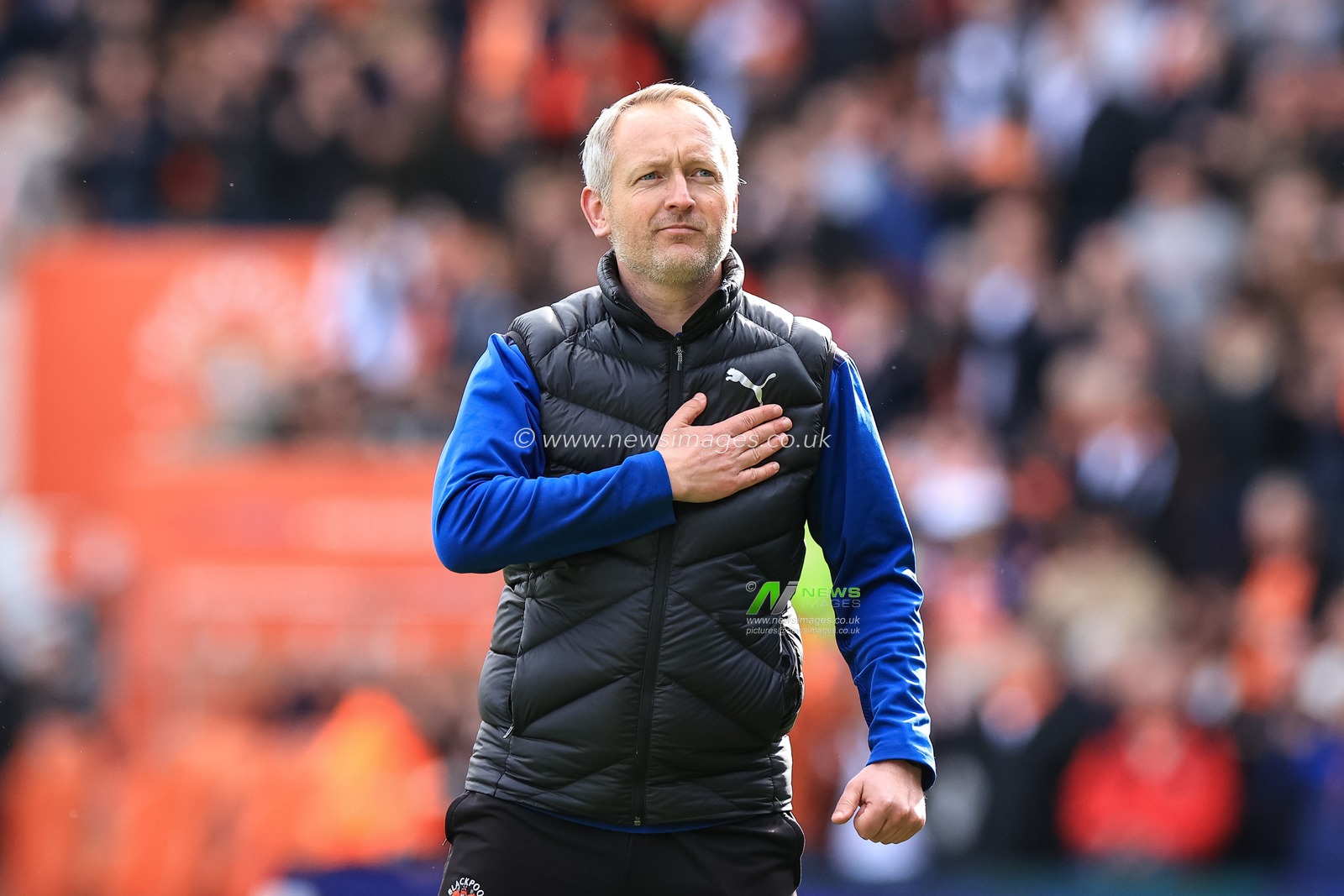 Neil Critchley head coach of Blackpool celebrates with the home fans after Blackpool win 6-1