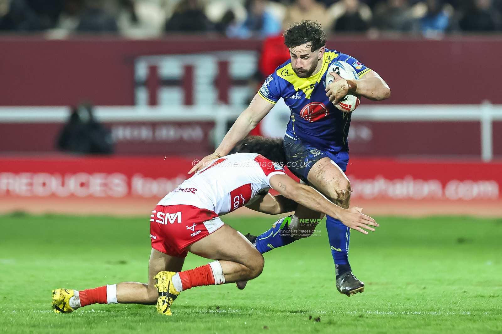 Toby King of Warrington Wolves is tackled by Tyrone May of Hull KR during the Betfred Super League Round 4 match Hull KR vs Warrington Wolves at Sewell Group Craven Park, Kingston upon Hull, United Kingdom, 7th March 2024

(Photo by Mark Cosgrove/News Images)