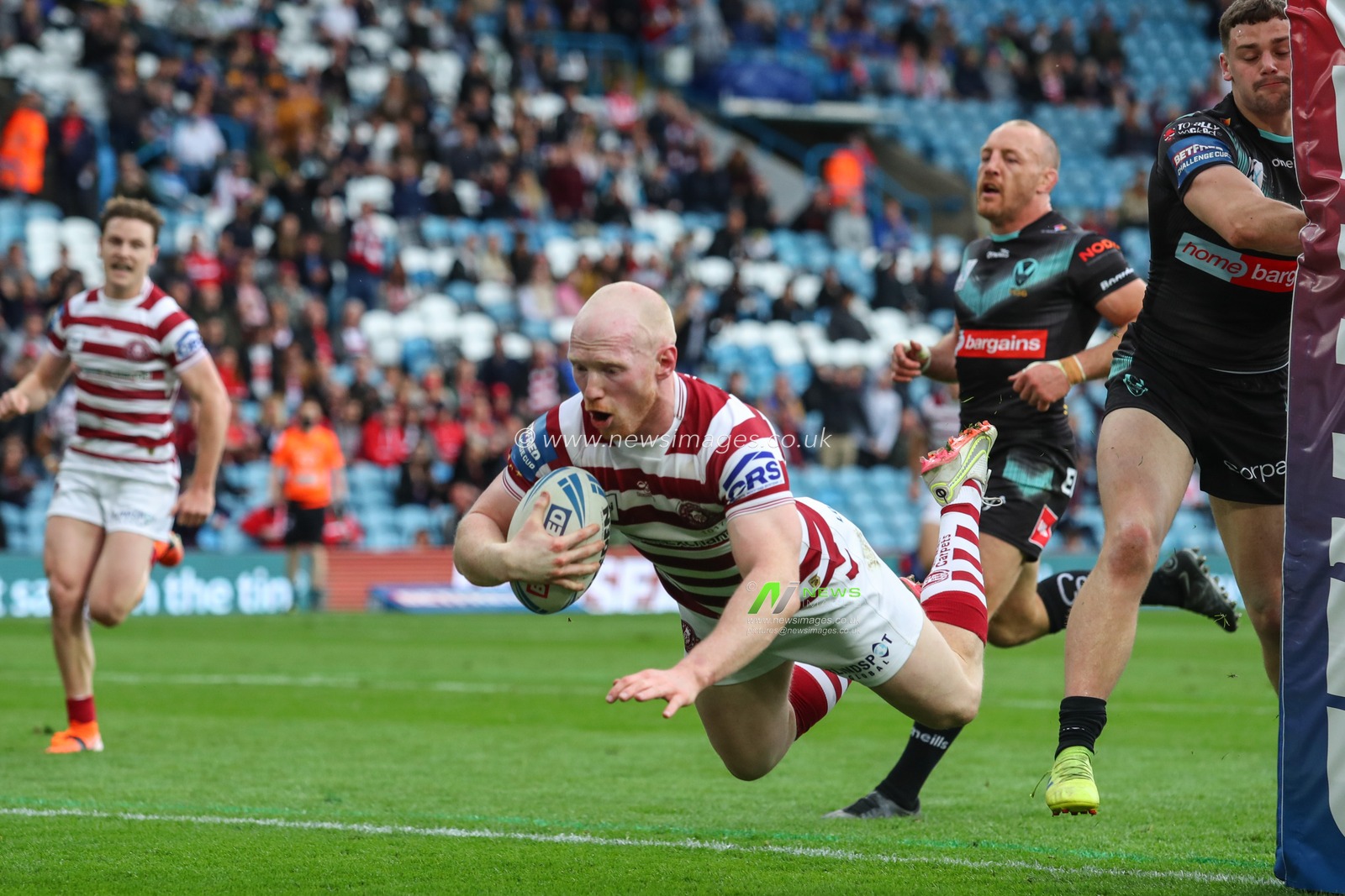 Liam Farrell #12 of Wigan Warriors goes over for a try to make it 12-0