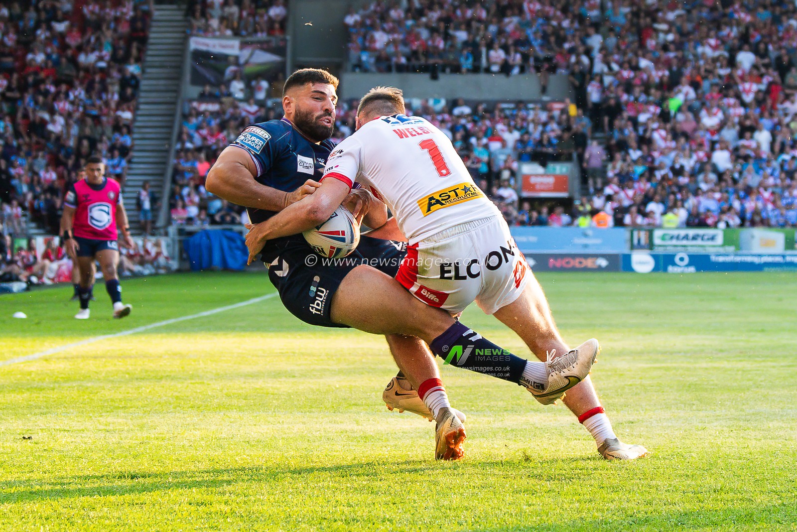 Abbas Miski #23 of Wigan Warriors is tackled by Jack Welsby #1 of St Helens  during the Betfred Super League Round 15 match St Helens vs Wigan Warriors at Totally Wicked Stadium, St Helens, United Kingdom, 9th June 2023

(Photo by Craig Thomas/News Images)