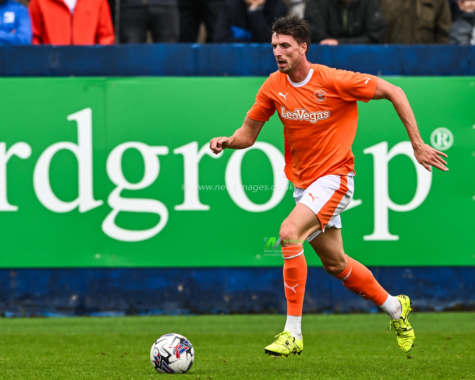 Jake Beesley #18 of Blackpool makes a break with the ball  during the Pre-season friendly match Barrow vs Blackpool at SO Legal Stadium, Barrow-in-Furness, United Kingdom, 22nd July 2023

(Photo by Craig Thomas/News Images)
