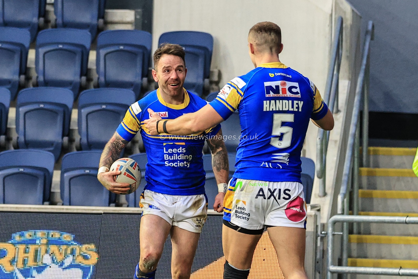 Richie Myler of Leeds Rhinos celebrates his try with Ash Handley of Leeds Rhinos