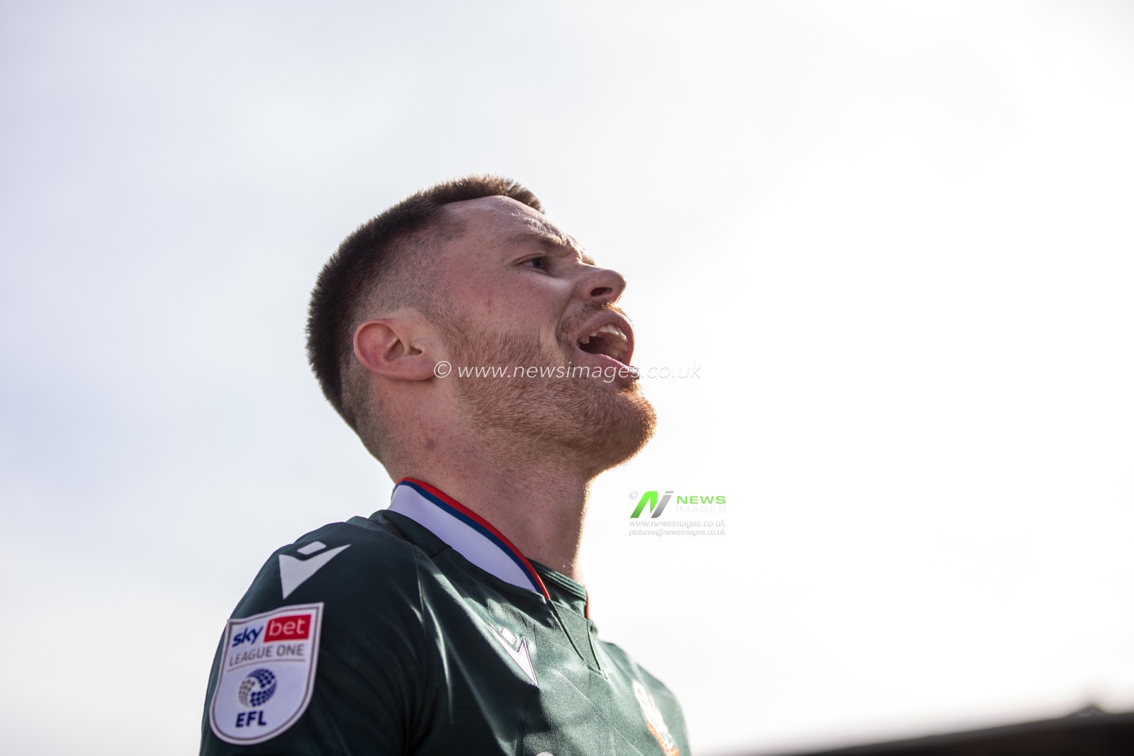 Will Forrester of Bolton Wanderers riles the Wrexham fans during the Sky Bet League 1 match Wrexham vs Bolton Wanderers at SToK Cae Ras, Wrexham, United Kingdom, 1st March 2025

(Photo by Nik Mesney/News Images)