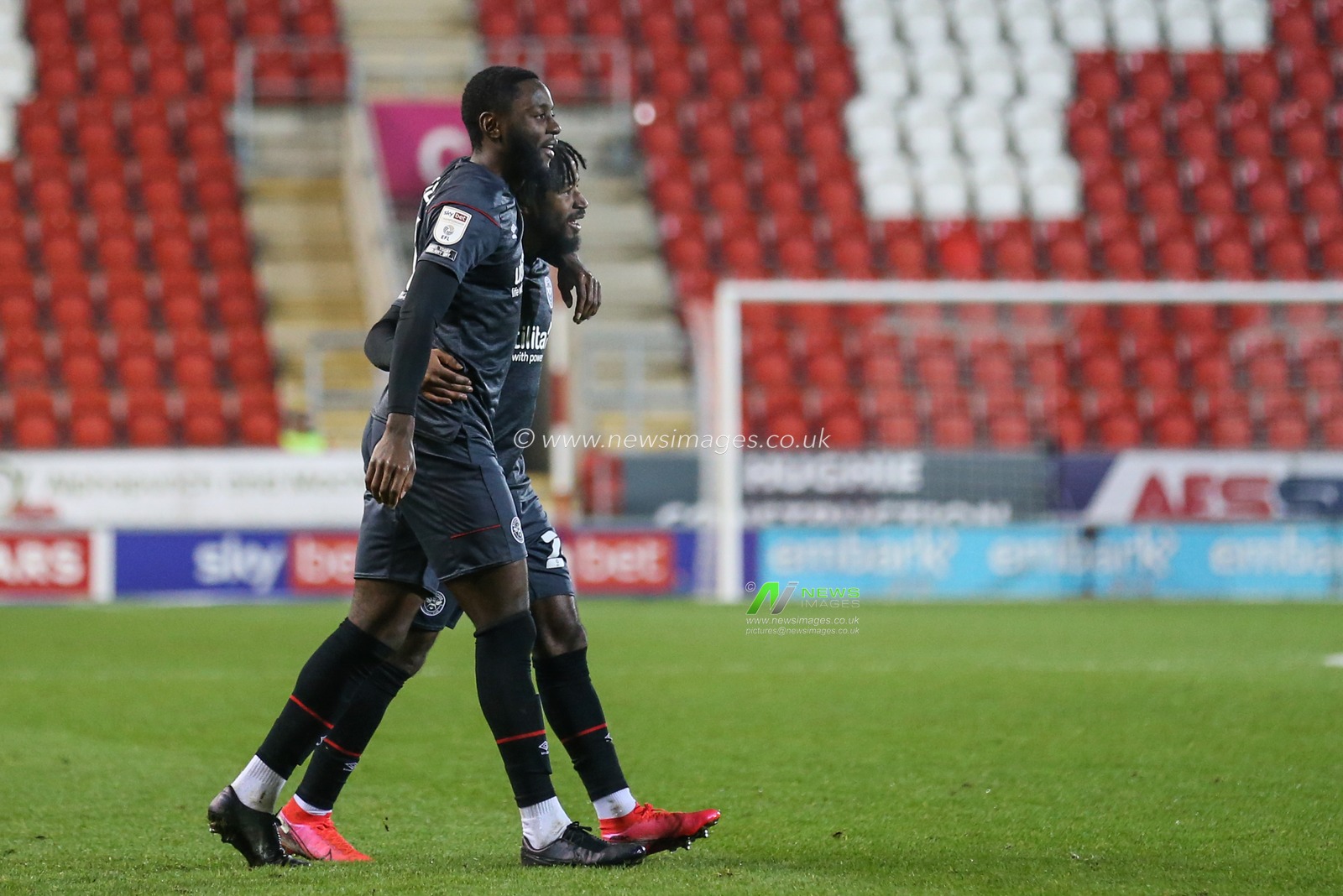 Tariqe Fosu #24 of Brentford and Josh Dasilva #14 of Brentford celebrate Marcus Forss #15 of Brentford goal to make it 0-1