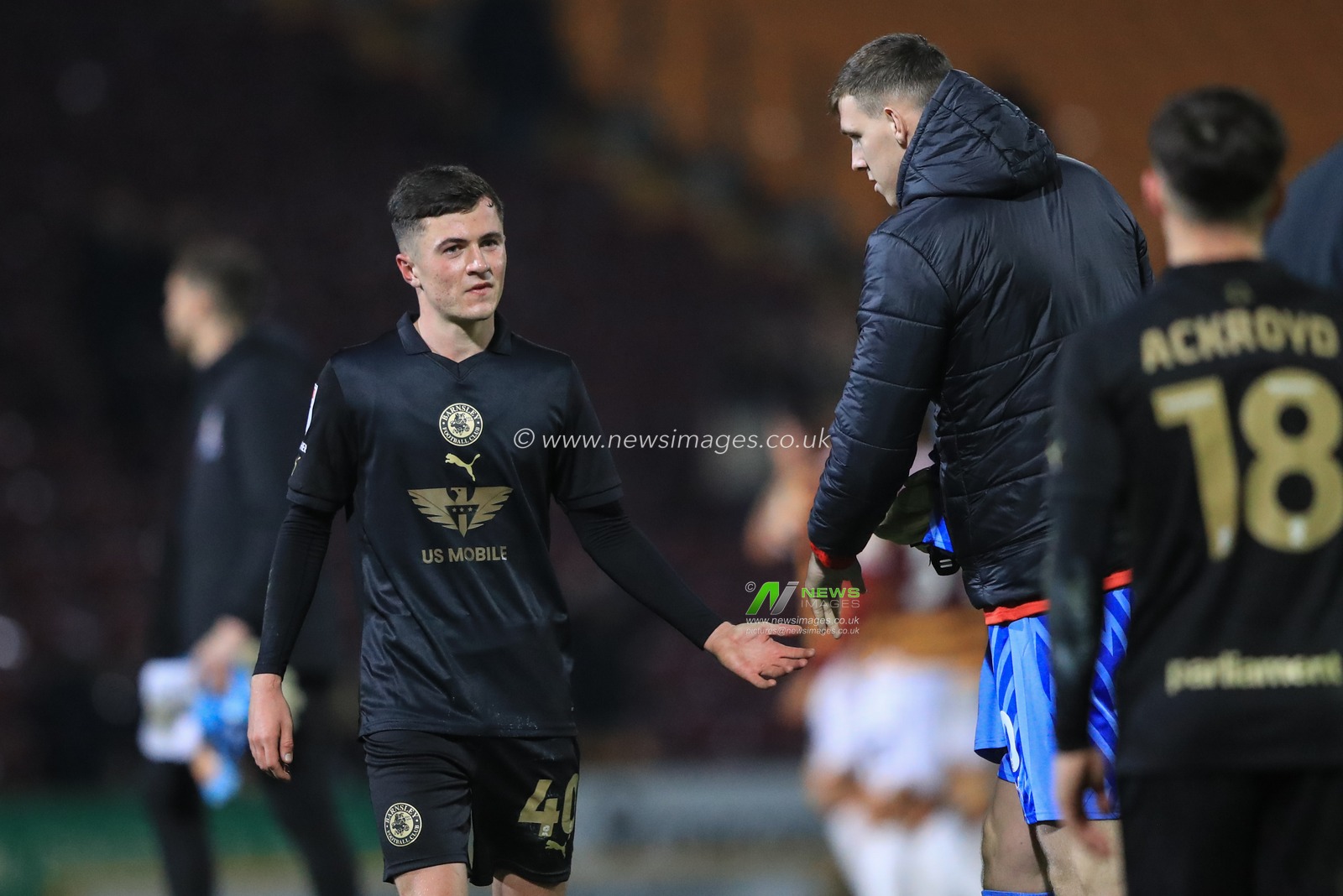 Aaron Atkinson #40 of Barnsley shakes hands with Kieren Flavell #50 of Barnsley during the Bristol Street Motors Trophy match Bradford City vs Barnsley at University of Bradford Stadium, Bradford, United Kingdom, 21st November 2023

(Photo by Alfie Cosgrove/News Images)